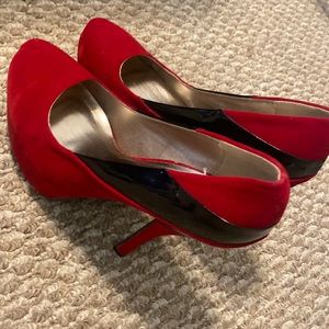 Red velvet and black platform heels